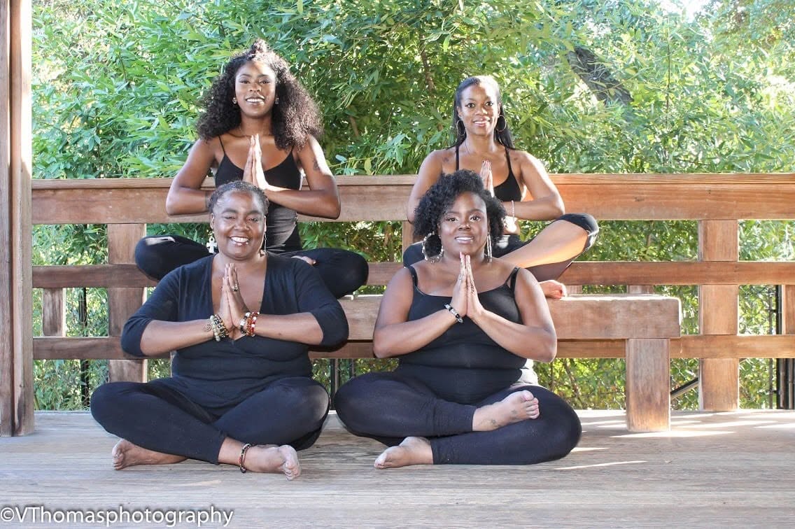 Four women sharing an outdoor group movement practice
